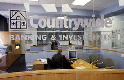 
An employee of Countrywide Financial helps customers at the Northridge branch of Los Angeles, Calif. Associated Press
 (Associated Press / The Spokesman-Review)
