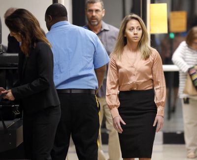 Fired Dallas police Officer Amber Guyger, right, arrives for jury selection in a murder trial at the Frank Crowley Courthouse in downtown Dallas, Friday, Sept. 13, 2019. Guyger shot and killed Botham Jean, an unarmed man in his own apartment last year. (Tom Fox / Associated Press)