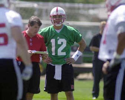 
Nebraska football coach Bill Callahan, left, explains the Cornhuskers' new passing offense to quarterback Joe Dailey. 
 (Associated Press / The Spokesman-Review)