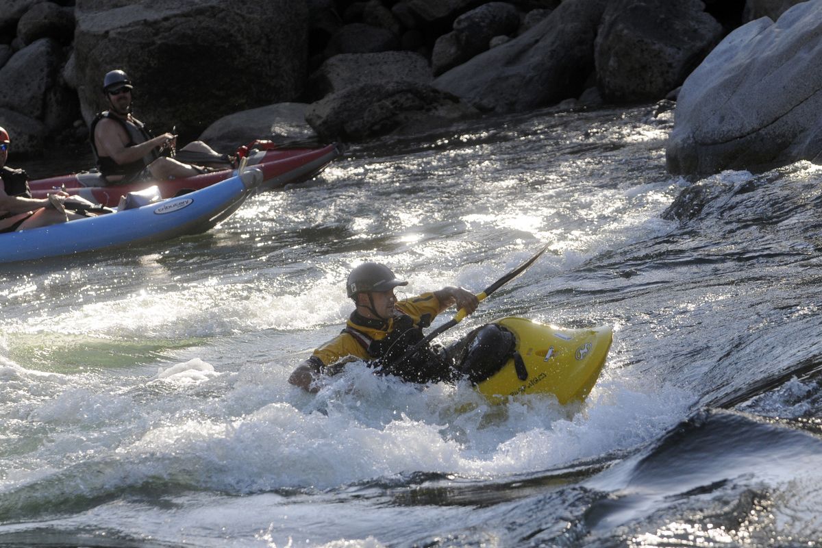 Spokane Valley kayaker Steve Bailey surfs the "Sullivan Hole" on the upper Spokane River, Mon. evening, August 1, 2011. The wave is a Spokane low water play spot for whitewater enthusiasts. J. (J. Rayniak / The Spokesman Review)