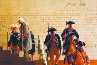 
Visitors and Revolutionary War re-enactors pass each other on the staircase between the ground level and the newly opened Donald W. Reynolds Museum and Education Center at Mount Vernon, Va. 
 (Associated Press / The Spokesman-Review)