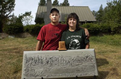 
Justin Reardon and his mother, Ronda, pose Friday at their Deer Park area business that incorporates ashes with stone monuments. 
 (Brian Plonka / The Spokesman-Review)