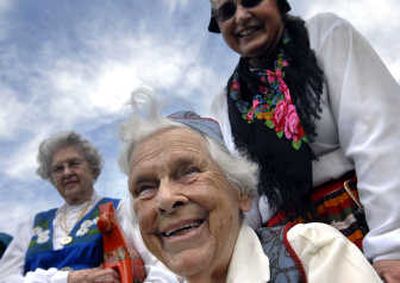 
lma Johnson, 88, is all smiles as she and other members of the Spokane Vasa Order of America, a Swedish-American fraternal order, wait to participate in the multicultural fashion show at Unity in the Community in Riverfront Park on Saturday.  
 (Photo by Jed Conklin / The Spokesman-Review)