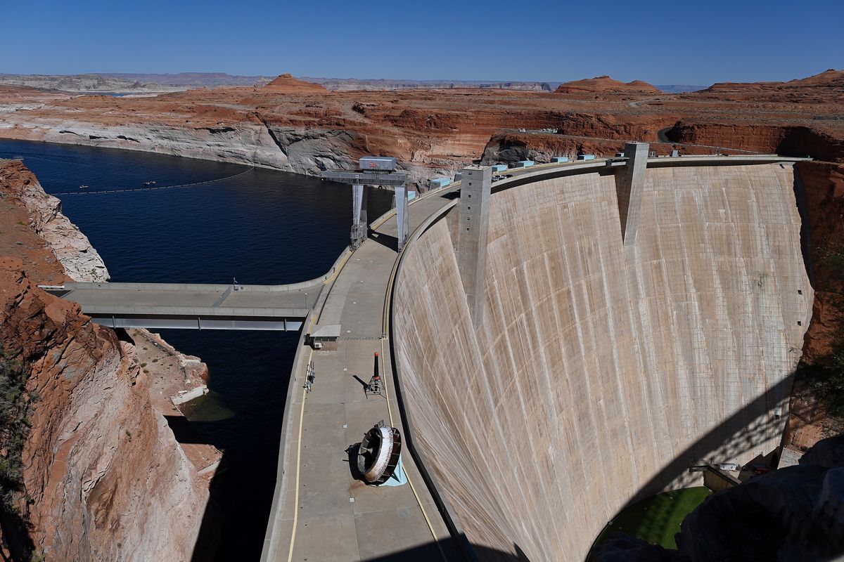 The Glen Canyon Dam sits above Lake Powell and the Colorado River in Page, Ariz. Federal officials project that, as soon as July, water levels in the lake could fall to a point where the hydroelectric plant inside the dam could not produce power.  (Joshua Lott/The Washington Post)