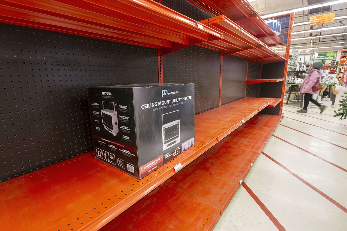 A customer walks by nearly-empty shelves for space heaters on Thursday, Oct. 9, 2023, at Moscow-Building Supply in Moscow, Idaho. Moscow Building Supply and Pullman Building Supply both stayed open late on Wednesday to sell heaters because of a natural-gas outage on the Palouse.  (Geoff Crimmins/For The Spokesman-Review)