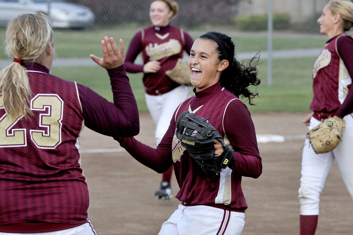 Brittany Hecker, left, and Ryelynn Mendoza celebrate a University High double play. (Jesse Tinsley)