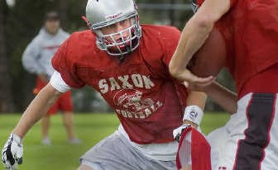
Ferris running back/defensive back McKenzie Murphy moves in for a tackle during drills at a recent practice. The two-way star is expected to lead the Saxons in the upcoming season when they are favored to win the Greater Spokane League title.
 (Christopher Anderson / The Spokesman-Review)