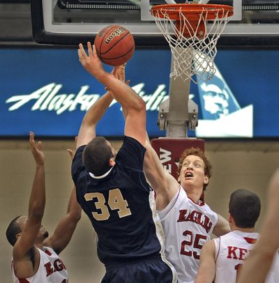 Eastern’s Jordan Hickert blocks the shot of Connor Osborne, who led Northern Colorado with 17 points. (Christopher Anderson)