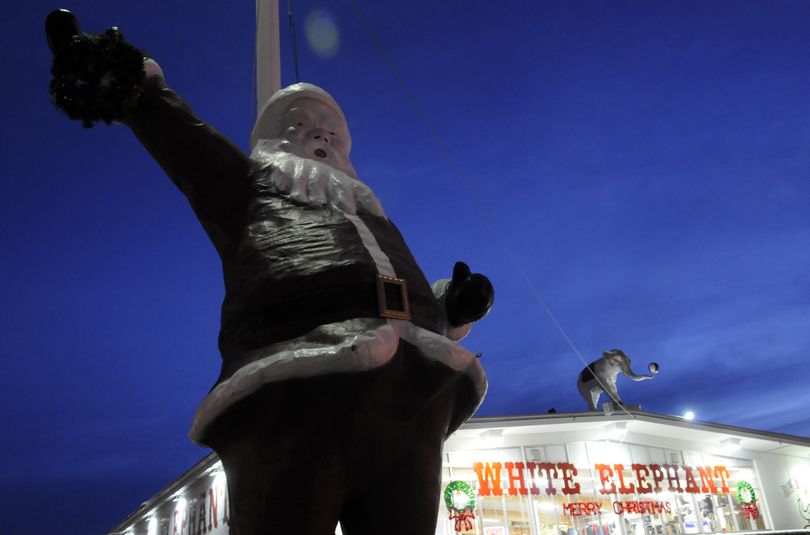 For 22 years, Santa has stood proudly in the parking lot at the White Elephant store on East Sprague Avenue in the Spokane Valley waving  at passersby. The 13-foot-tall statue once graced the windows of The Crescent department store in downtown Spokane. (J. BART RAYNIAK)