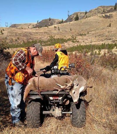 Jessie Williams watches as her grandpa, Del Williams, straps on the whitetail buck she bagged on opening weekend of Eastern Washington’s 2017 general deer season. Jessie, a sophomore at Reardan High School, has tagged a buck every season since she started hunting five years ago. (Travis Williams / Courtesy photo)