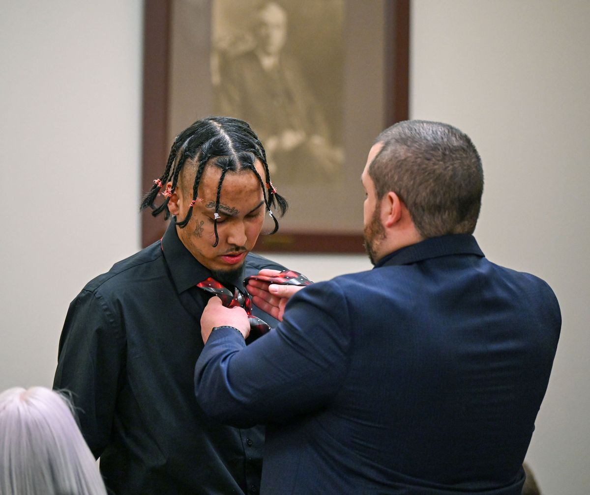 Ray Wynecoop, left, gets an assist with his necktie from Deputy Prosecutor Preston McCollam on Friday afternoon in the Spokane County Courthouse.  (DAN PELLE/THE SPOKESMAN-REVIEW)