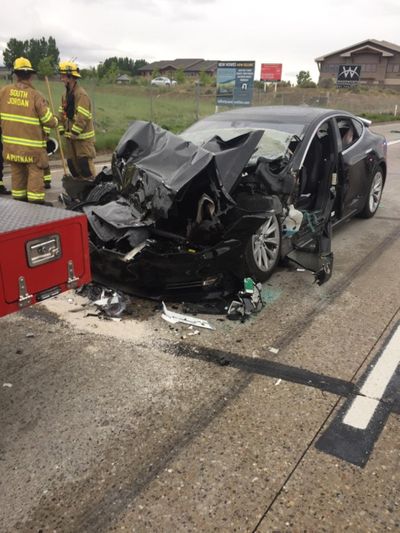This photo released by the South Jordan Police Department shows a traffic collision involving a Tesla Model S sedan with a Fire Department mechanic truck stopped at a red light May 11, 2018, in South Jordan, Utah. The driver of a Tesla electric car that hit a Utah fire department vehicle over the weekend said the car's semi-autonomous Autopilot mode was engaged at the time of the crash. (Associated Press)