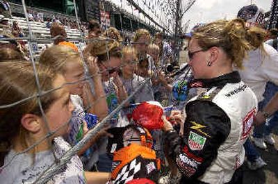 
Race driver Sarah Fisher signs autographs for her young female fans at Indy. Race driver Sarah Fisher signs autographs for her young female fans at Indy. 
 (Associated PressAssociated Press / The Spokesman-Review)