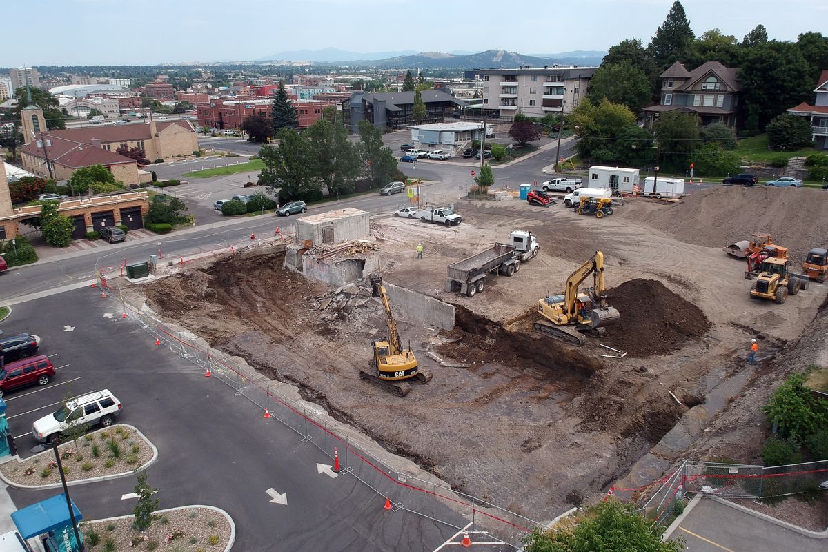 Baker Construction is preparing the site of the former Greenough’s grocery store, near Sixth Avenue and Washington Street in Spokane, for a new building by removing the last of the basement and foundation concrete, Tuesday, July 28, 2020.  (Jesse Tinsley/THE SPOKESMAN-REVIEW)