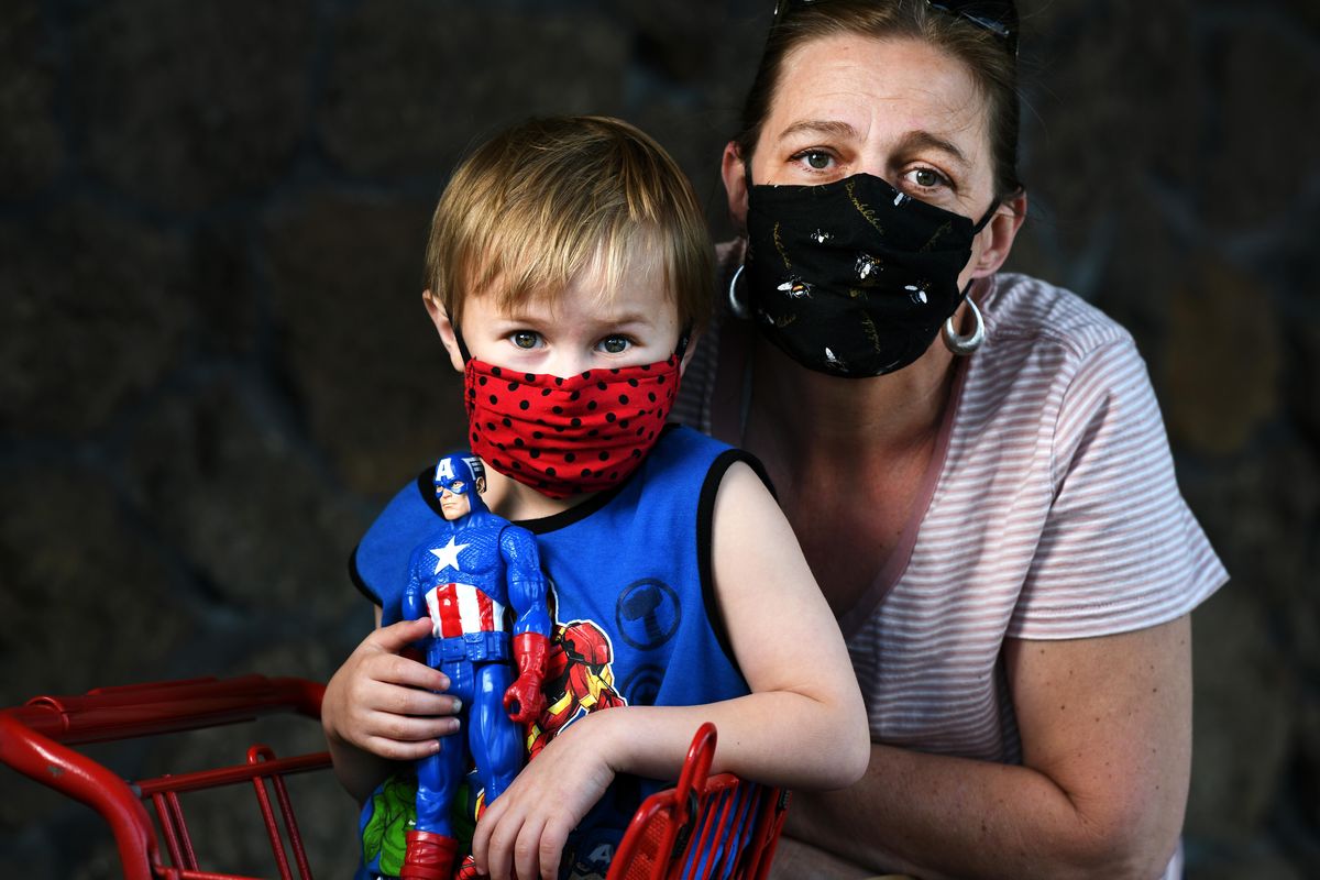 Sharon Sedgwick photographed with grandson Kai, age 5. Sedgwick, who lives in Idaho, has been staying with her daughter in Spokane to help out where she can. “We’re doing OK,” said Sedgwick. “We did curbside pick up from Michaels and got a ton of paints, crafts and stuff. We’re also digging in the garden outside.” (Colin Mulvany / The Spokesman-Review)