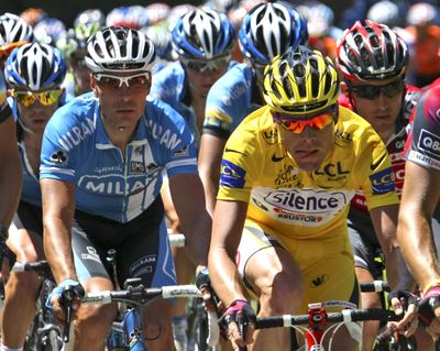 Overall leader Cadel Evans of Australia, right, and Germany’s Erik Zabel, left, ride in a pack during the 11th stage. (Associated Press / The Spokesman-Review)