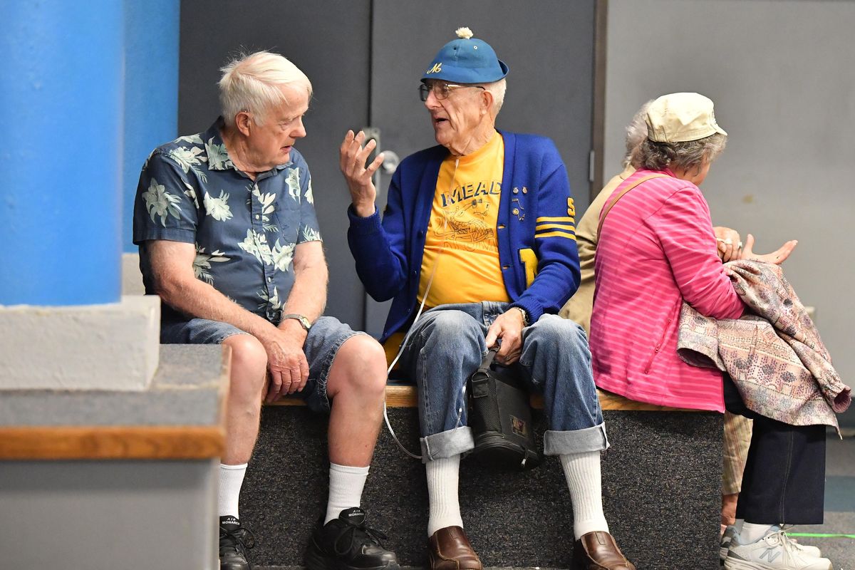 Dale Preedy, right, and his older brother Ernie, reminise about their time at Mead Middle School when it was a high school, Thursday, June 20, 2019, during a farewell open house at the old school in Mead. The elder graduated in 1949, the younger in 1954. The school converted to a middle school in the fall of 1971. A new sports complex is planned at the school site after the building is demolished. (Tyler Tjomsland / The Spokesman-Review)