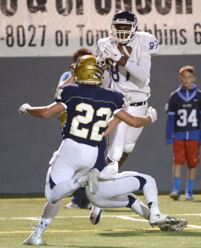 Gonzaga Prep receiver Devin Culp, above, hauls in a long pass at the 5-yard line. (Jesse Tinsley)