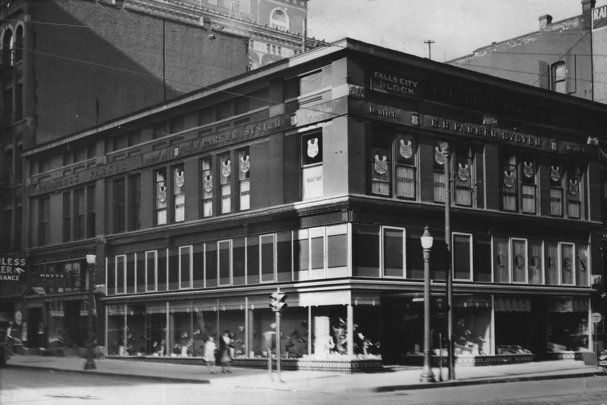 1944 - The Falls City Building at 801 W. Riverside Ave. was built by Daniel H. Dwight, whose office was always on the second floor of this building, which he rebuilt in 1890 after the Great Fire of 1889. Among the many retail and service businesses, including dentists, clothing and music stores, was Washington Mutual Co., later a bank, which started here in 1910. (The Spokesman-Review Photo Archive / sr)