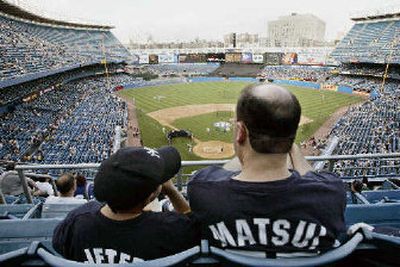 
New York Yankees fans may watch the team from a new stadium by 2009.
 (Associated Press / The Spokesman-Review)