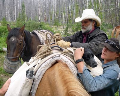 Greg and Deborah Schatz rescue cocker spaniels Abby, at left, and Molly with ride on their horse.