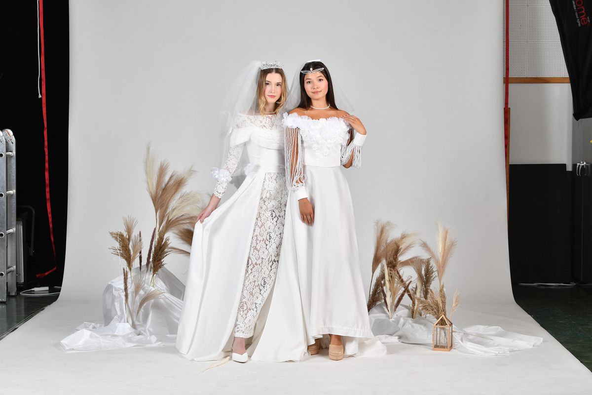 Models wear two of Mya Phan’s wedding dresses. Phan’s designs are modular, containing different pieces that can be removed or changed.  (Courtesy of Mya Phan)