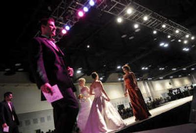 
Models traverse the runway during the Bridal Festival's fashion show Saturday. 
 (Dan Pelle / The Spokesman-Review)