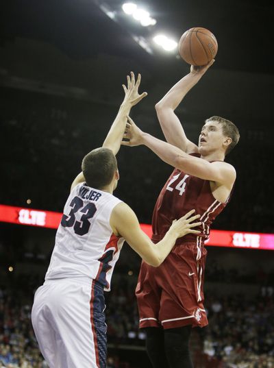 Washington State’s Josh Hawkinson takes a shot against Gonzaga’s Kyle Wiltjer. (Associated Press)