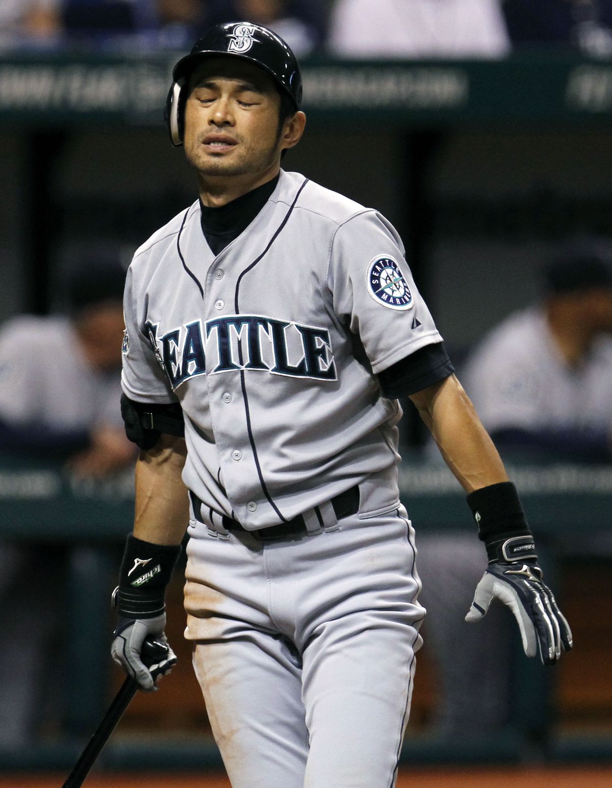 Ichiro Suzuki reacts after striking out in the third inning. (Associated Press)