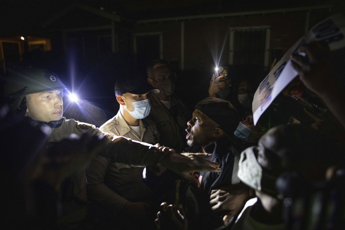 Protesters clash with deputies of the Los Angeles Sheriff