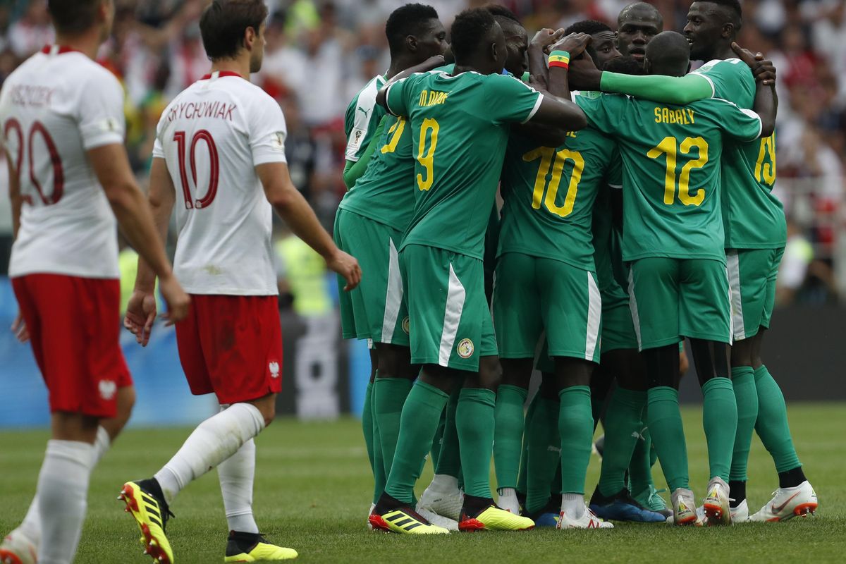 Senegal’s Idrissa Gana Guey celebrates with teammates after scoring the opening goal during the group H match between Poland and Senegal at the 2018 soccer World Cup in the Spartak Stadium in Moscow, Russia, Tuesday, June 19, 2018. (Darko Vojinovic / Associated Press)