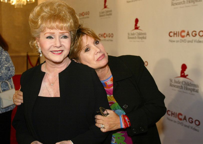 Debbie Reynolds and Carrie Fisher, pictured in 2003, are the subject of an HBO documentary that will air on Saturday, Jan. 7. The show initially was set to air in the spring, but HBO moved it up to next weekend in the wake of their deaths last week. (Jill Connellly / ASSOCIATED PRESS)