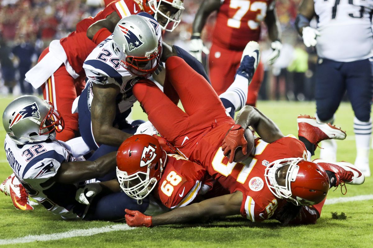 Chiefs running back Jamaal Charles falls into the end zone for the second of his three total touchdowns. (Associated Press)