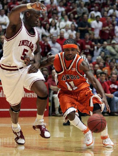 
Illinois' Dee Brown, right, drives to the basket against Indiana's Marco Killingsworth during the first half of Indiana's win. 
 (Associated Press / The Spokesman-Review)
