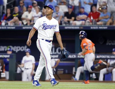 Texas relief pitcher Jose Leclerc watches Jose Altuve’s three-run homer in the ninth Friday during Houston’s 5-4 ALCS win n Arlington, Texas.  (Tom Fox)