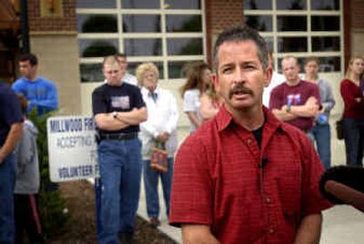 
Millwood Fire Chief Bill Clifford speaks with media with supporters behind him at Millwood Fire Station on Tuesday. Millwood Fire Chief Bill Clifford speaks with media with supporters behind him at Millwood Fire Station on Tuesday. 
 (Holly Pickett/Holly Pickett/ / The Spokesman-Review)