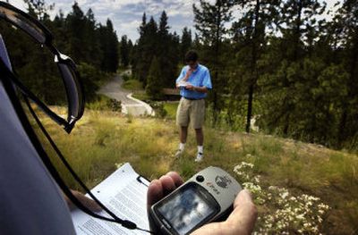 
Fred Joslin, of Inland Northwest Community Access Network, works on mapping waypoints on his Global Positioning System at Manito Park on Wednesday. Students from Republic, Newport and Colville High Schools will be taking a one week course on GPS. Wednesday's GPS course helped teachers from the schools learn about the systems. 
 (Jed Conklin / The Spokesman-Review)