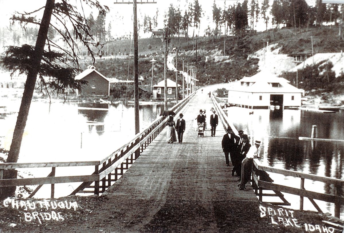 The 812-foot Chautauqua Bridge was opened in July of 1912, just before the opening of the first Spirit Lake Assembly. Chautauqua Park lies several hundred yards behind the photographer. The Spirit Lake Navigation Co’s. white boathouse sits in the right background.Courtesy of the Museum of North Idaho (Courtesy of the Museum of North Idaho / The Spokesman-Review)