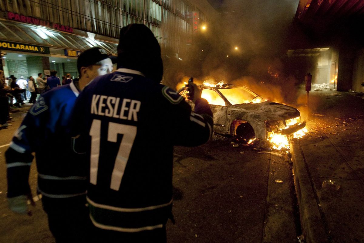 Vancouver Canuck hockey fans take part in a riot in downtown Vancouver,  Canada on Wednesday, June 15, 2011 following the Vancouver Canucks 4-0 loss to the Boston Bruins in game 7 of the Stanley Cup hockey final. (Ryan Remiorz / The Canadian Press)