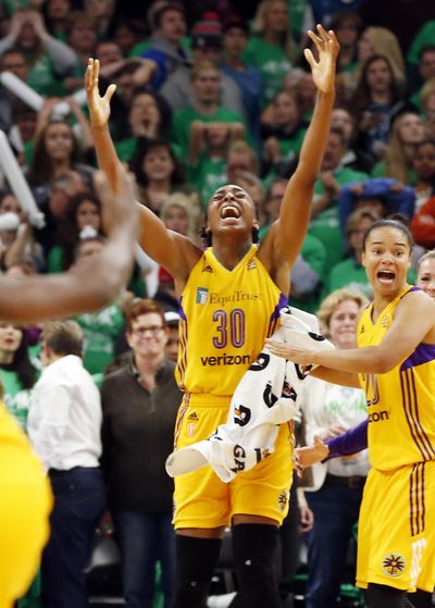 Sparks' Nneka Ogwumike, center, celebrates her winning basket. (Jim Mone / Associated Press)
