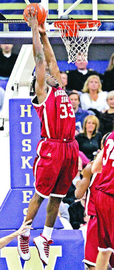 
Washington State forward Ivory Clark dunks the ball in the first half at Seattle. 
 (Associated Press / The Spokesman-Review)