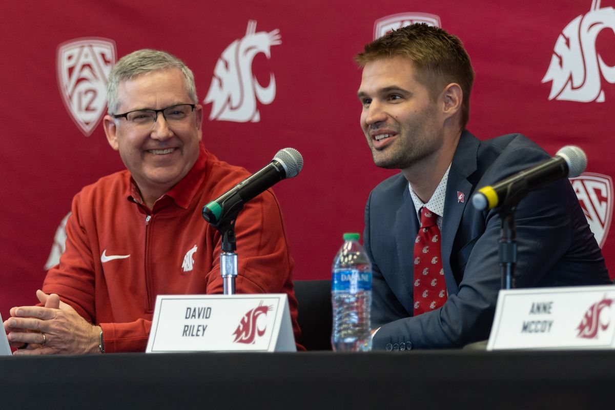 Washington State University President Kirk Schulz, left, listens while David Riley speaks at a press conference where he was introduced as the men’s basketball coach on Thursday, April 4, 2024, at Gesa Field in Pullman. (Geoff Crimmins/For The Spokesman-Review)