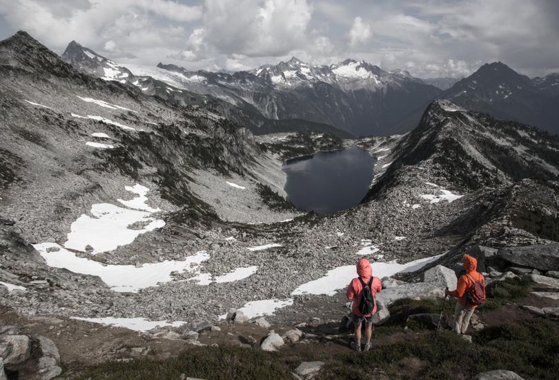 Backpackers look down on Hidden Lake, reached by a 4.5-mile hike about 15 miles east of Marblemount in North Cascades National Park. Bob Drzymkowski and his family from Spokane camped three nights in the area, with classic Cascades climbing destinations in the background, from left to right, Eldorado, Mount Torment and Forbidden Peak. “About a half hour before this shot, we were part of a party of 12 that sat out a nasty hailstorm in the Hidden Lake Fire Lookout,” he said, noting that it’s no longer in use for fire protection but well preserved and maintained by a local hiking club.