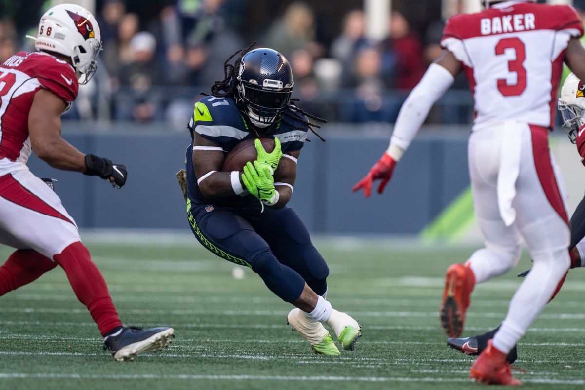 Seattle Seahawks running back Alex Collins runs with the ball during an NFL football game against the Arizona Cardinals, Sunday, Nov. 21, 2021, in Seattle. The Cardinals won 23-13.  (Stephen Brashear)