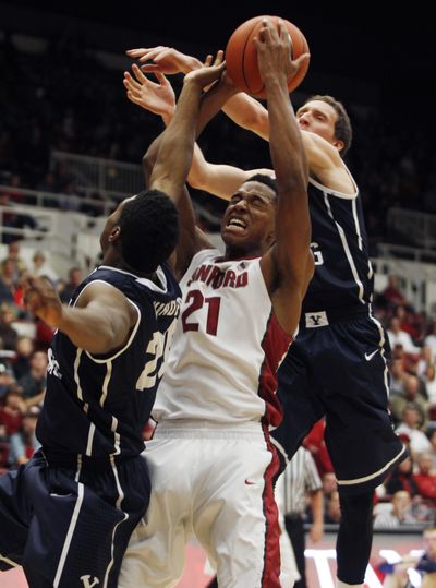 Anthony Brown, center, and Stanford conceded more than 100 points in a loss to BYU. (Associated Press)