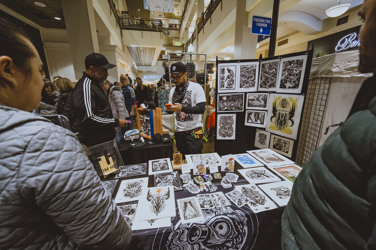 Reinaldo Gil Zambrano, of RGZ Prints, sells woodcut prints at River Park Square during 2023’s BrrrZaar. This year’s event runs 10 a.m.-8 p.m. Saturday.  (Courtesy of Hector Aizon)