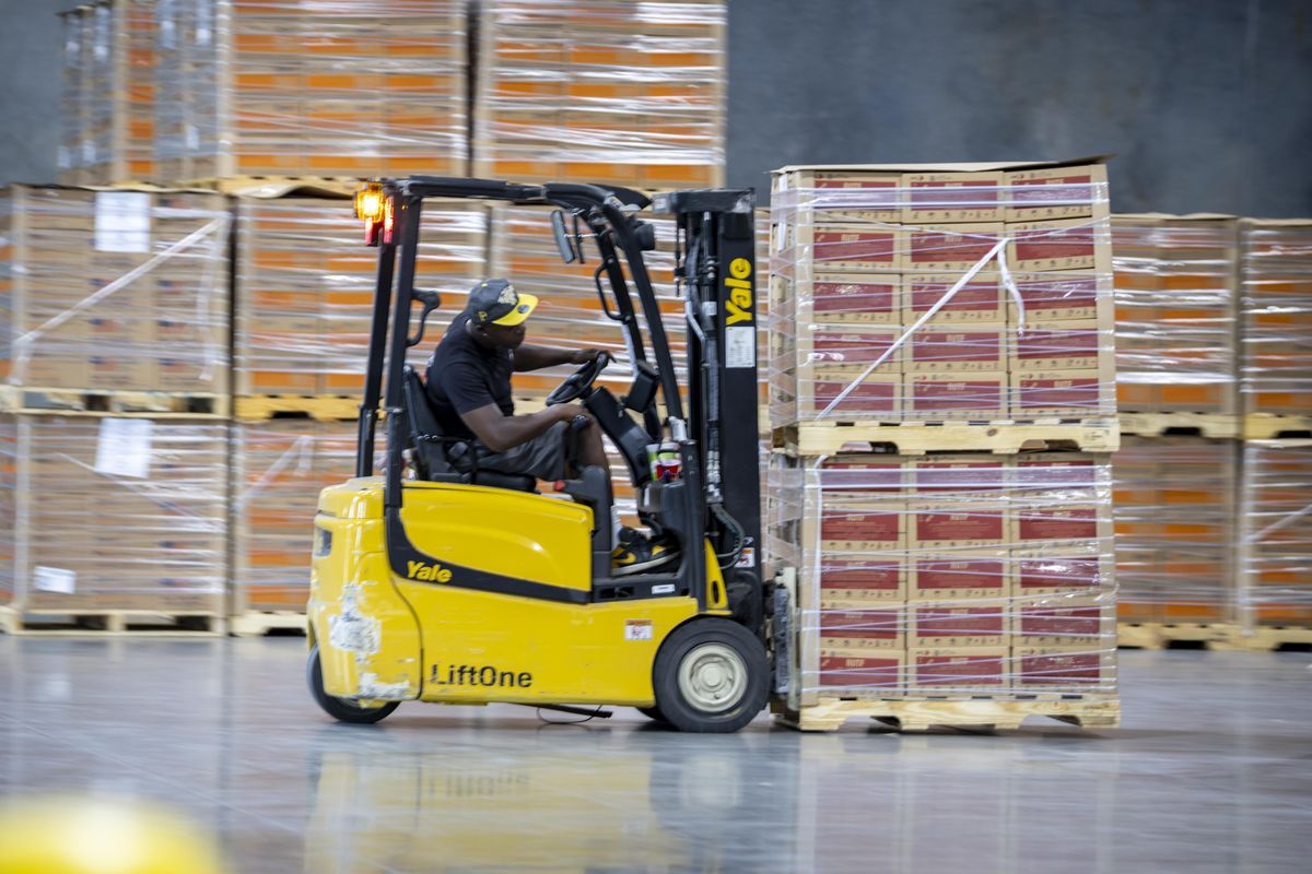 A forklift driver unloads pallets of Ready-to-Use Therapeutic Food, or RUTF, from a new delivery at the MANA Nutrition warehouse, on Wednesday in Pooler, Ga. More than 300,000 boxes of nutritional peanut paste, already paid for by taxpayers, are sitting in a warehouse in Pooler, Ga. (Stephen B. Morton/ for the Washington Post))