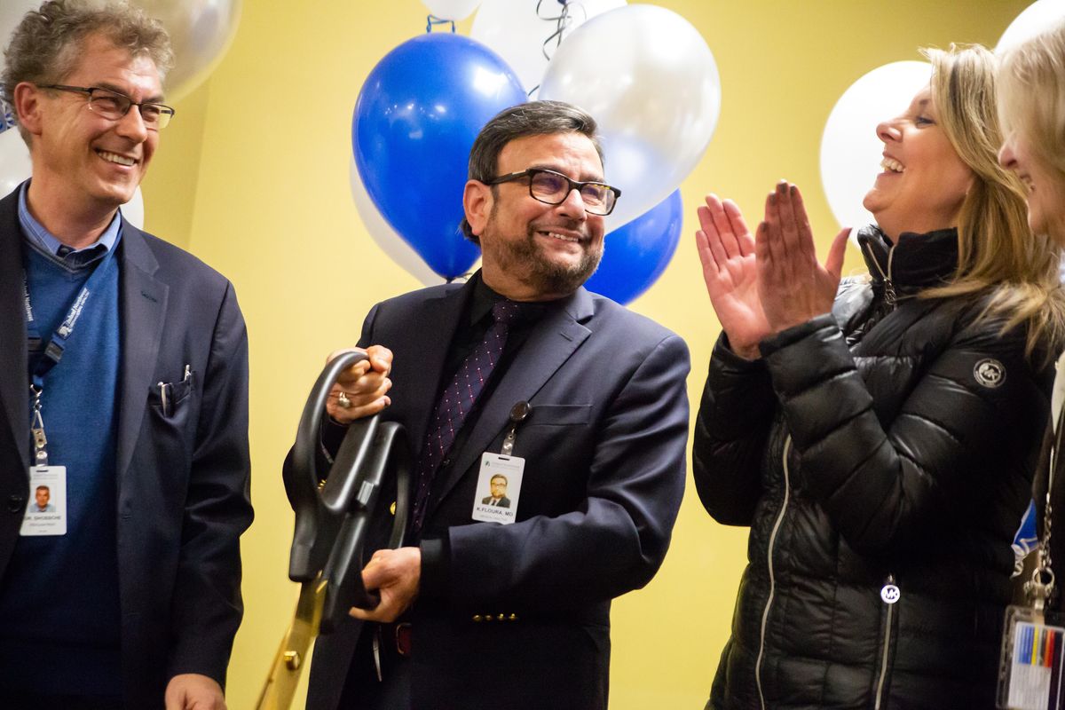 Dr. Dirk Dhossche, child & adolescent unit director (left), Kamaljit Floura, chief medical officer (center) and Nadine Woodward, Mayor of Spokane, smile after cutting the ribbon in a ceremony to unveil the new adolescent inpatient wing at Inland Northwest Behavioral Health on Feb. 4, 2020. The facility provides 25 more beds in Spokane for acute care for adolescents