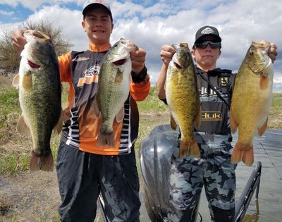 Blake Williams, left, and Tate Webb hold up bass they caught at Moses Lake in May. They will represent Washington in a national bass fishing competition in August. (Courtesy)