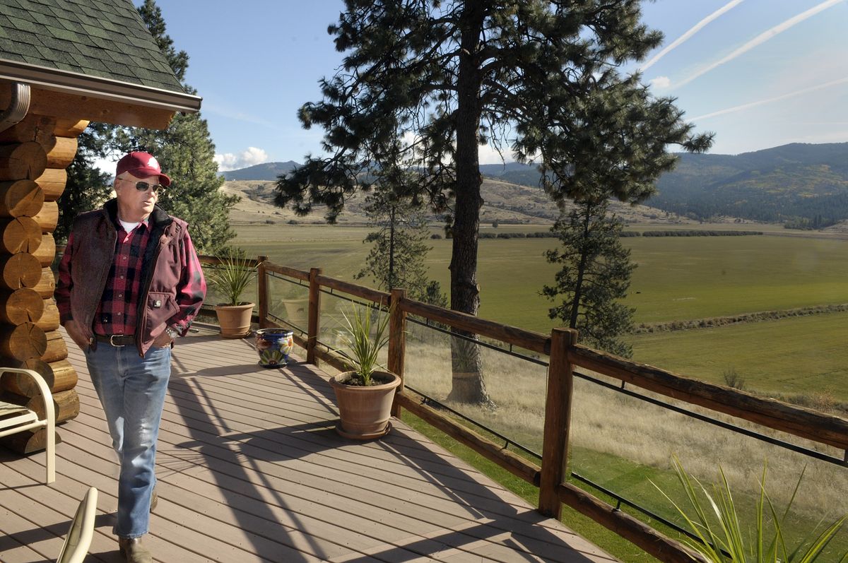 Bud Morrison looks over his pasture land from the deck of his log home that overlooks the Saltese Flats Tuesday October 14, 2008. Morrison and his family have farmed the area since 1892 and he is concerned with Spokane County plans on environmental issues in the area.  (Photos by CHRISTOPHER ANDERSON / The Spokesman-Review)